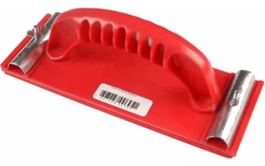 Red plastic manual hand sander tool with a comfortable grip handle and metal sandpaper clamps.