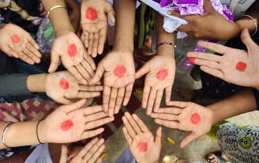Red dots on eleven children's' palms.