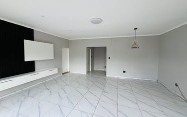 a room with a television and a flat screen TV, House Construction Frans-del Investment CC Constructi