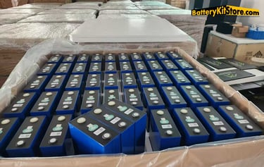 boxes of LiFePO4 prismatic battery cells in a warehouse