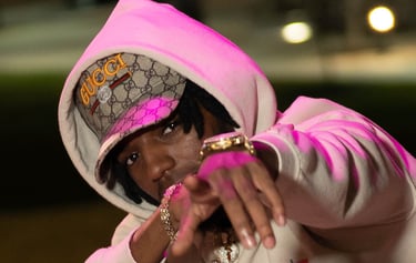 a woman in a hoodie and a pink hoodie