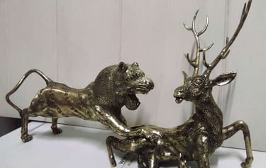"Handcrafted brass sculpture of a lion hunting a deer-Qualified for export"