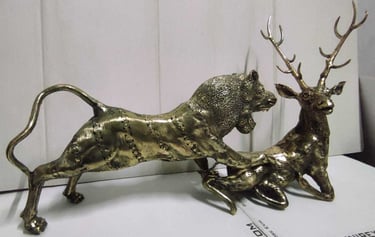 "Decorative brass piece depicting a lion chasing a deer-Globally tradable"