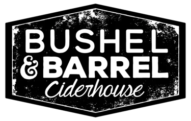 Rustic Bushel and Barrel Ciderhouse logo with white text in a distressed hexagonal frame on a black background.