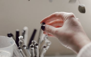 a person holding a small glass of water