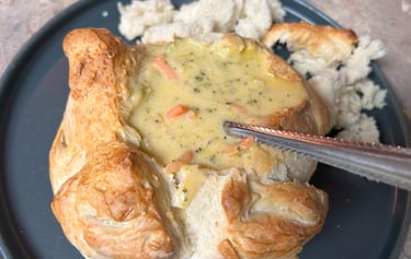 Bread bowl filled with brocoli cheddar soup