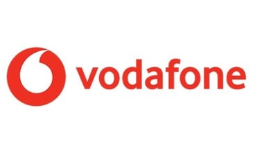 a woman in a red dress and a white shirt with the words vodafo