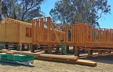Modular home offsite framing on crib bracing in Menifee.