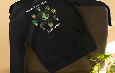 Cozy black hoodie with playful plant illustration — plant-lover sweatshirt from Miss Chatty Plants.