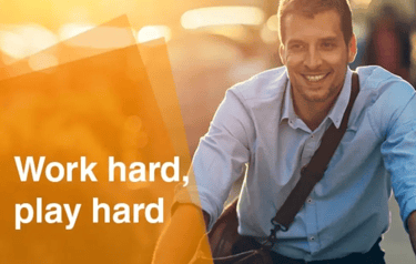 man biking, text 'work hard, play hard'