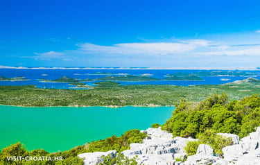 Birdwatching tower overlooking Vransko Lake surrounded by wetlands and cycling trails.