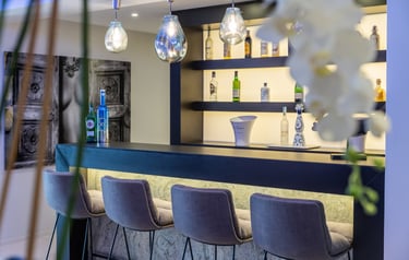 Modern private bar with designer seating at Villa Serenity Marbella