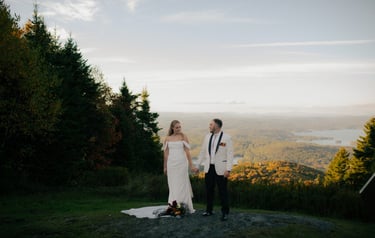 Bride and Groom standing at the top of Mount Sunapee Resort