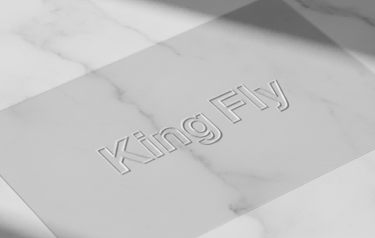 A clear PVC heat-pressed pouch with a perfect embossed King Fly LOGO, showing no stitching lines.