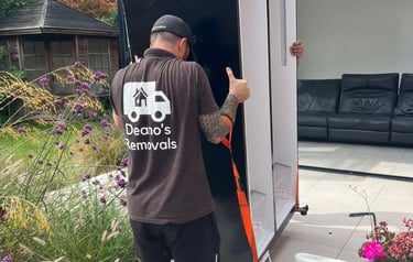 deanos removals worker carrying a fridge