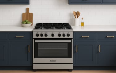 Blomberg gas range in a modern kitchen with navy cabinets and white tile backsplash.