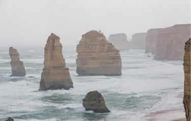 a few of rock standing on the beach