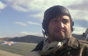 a man in a leather jacket and a helmet