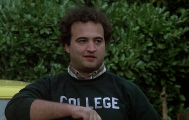 a man in a college uniform holding a frisbee