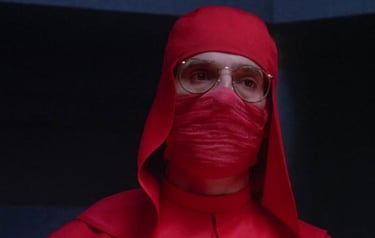 a man in a red robe and glasses