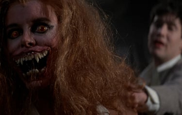 a man with a bloody face and a woman with a knife in her hand