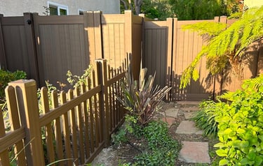 Custom chestnut brown vinyl picket and gates.