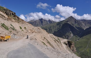 Tracey Billington riding the Leh to Manali highway over the great Himalayan range, Ladakh, India 