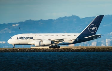 A Lufthansa aircraft parked near a body of water