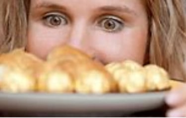 a woman is holding a plate with a plate of food craving