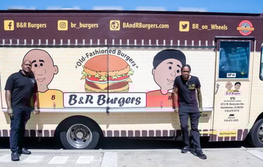 brother standing next to a food truck