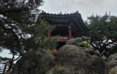 The commemorative Baekwajweong Pavilion on Nakhwaam Rock 