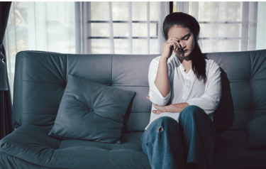 a woman sitting on a couch 