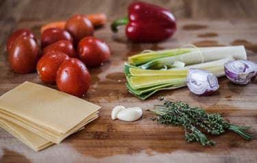 a bunch of vegetables and vegetables on a cutting board