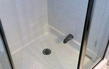 Shower tiles resurfaced to a bright clean finish