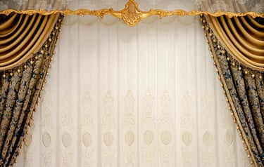 Elegant luxury gold and blue damask curtains with white lace sheers and ornate window valance decor.