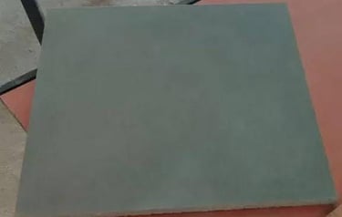 Square grey stone floor tile with a smooth matte finish for interior paving.