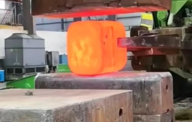 Titanium forging workshop with industrial equipment for custom titanium blocks and forgings