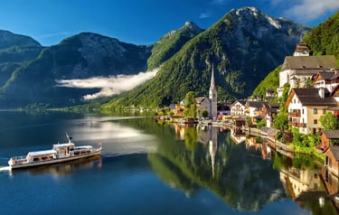 Scenic view of Hallstatt village, Austria, with alpine mountains reflected in Lake Hallstatt.