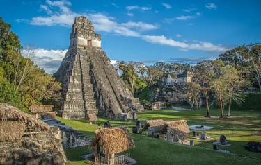 Ancient Mayan Tikal Temple I Rising Sun pyramid in the Guatemala jungle ruins.
