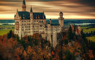 The Neuschwanstein Castle in Bavaria, Germany, stands atop a hill surrounded by autumn foliage at sunset.