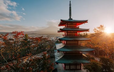 Sunset view of Chureito Pagoda and Mount Fuji with autumn foliage in Japan.