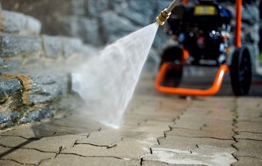 Pressure washer cleaning a paved path