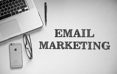 Minimal black and white workspace illustrating email marketing strategy.