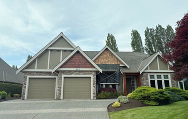 home partway through cedar shingle revitalization project in Qualicum Beach