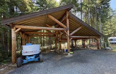 Courtenay log carport being refinished by Embassy Restorations, Vancouver Island