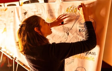 a woman is drawing on a white board