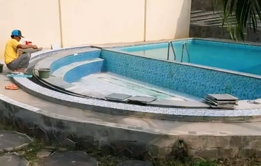 finising batu alam andesit kolam renang.