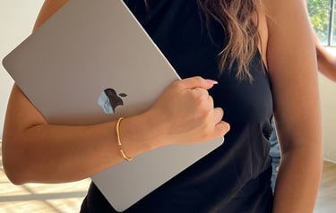 a woman holding a laptop computer