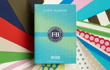 Farrow & Ball Carte Blanche color palette fan with Christopher John Rogers paint and wallpaper samples.