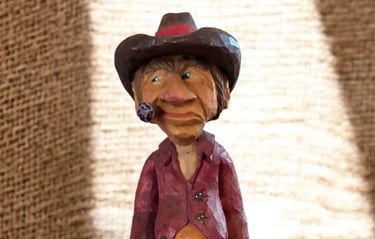 Cow Poke carved by Jim Oehmke